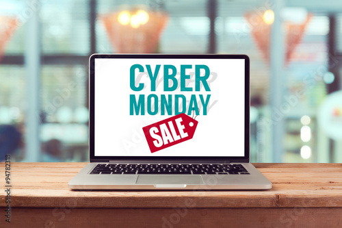 Cyber Monday sign on laptop computer. Holiday online shopping concept. View from above