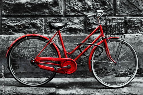 Lacobel Retro vintage red bike on black and white wall.
