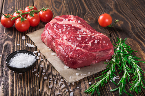 Zdjęcia Raw marbled meat steak Ribeye on dark wooden background