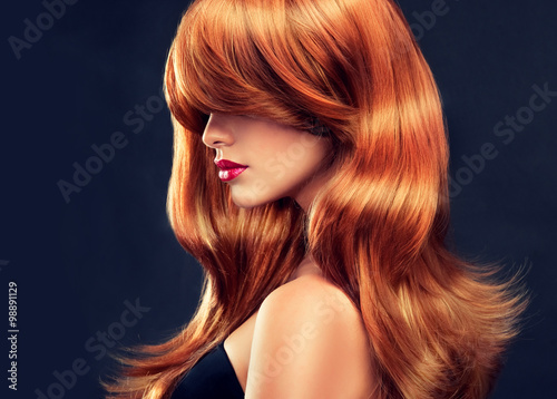 Zdjęcia Beautiful model girl with long red curly hair