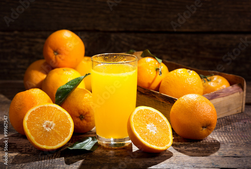 glass of orange juice with fresh fruits