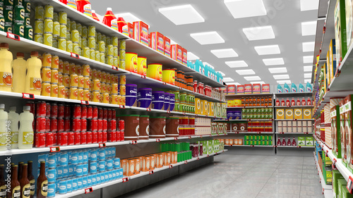 Supermarket interior with shelves full of various products.