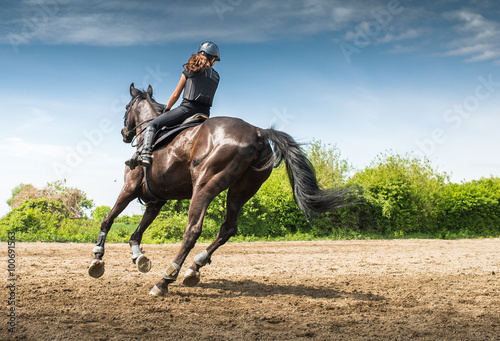 woman riding a horse Poster