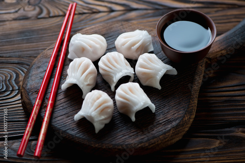 Plakát, Obraz Close-up of chinese dim-sum dumplings served with a soy sauce