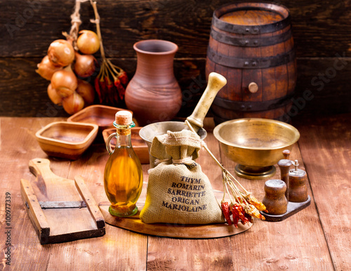 various kitchen utensils on rustic wooden table Poster