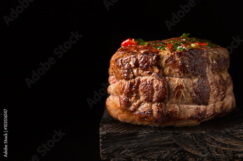Zdjęcia Grilled Steak Meat on the wooden surface