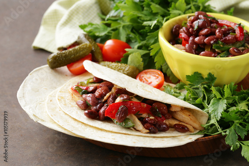 Zdjęcia Mexican food is tacos on wheat tortilla with chicken and beans