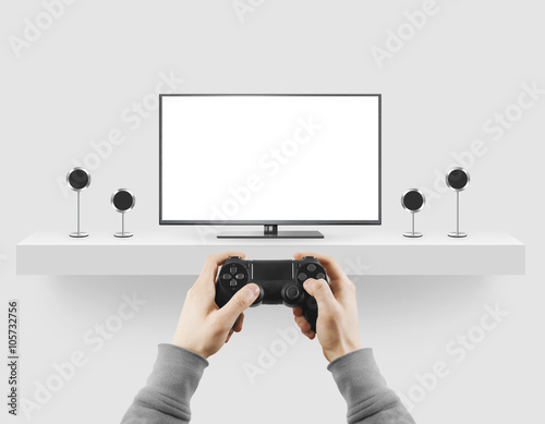 Poster Man hold gamepad in hands in front of blank tv screen mock up playing game