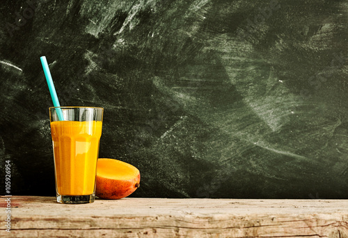 Bright mango fruit smoothie with copy space