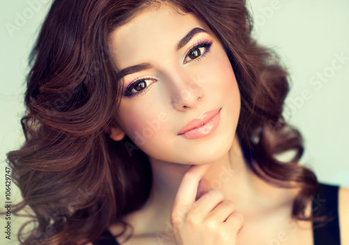 Zdjęcia Beautiful girl light brown hair with an elegant hairstyle , hair wave ,curly hai