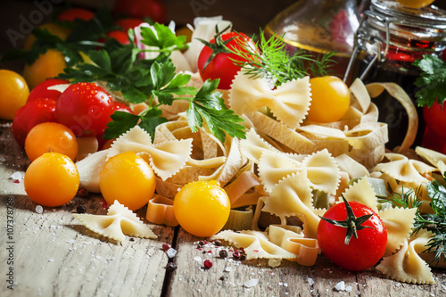 Poster Italian food: Assorted dry pasta, herbs, garlic, red and yellow