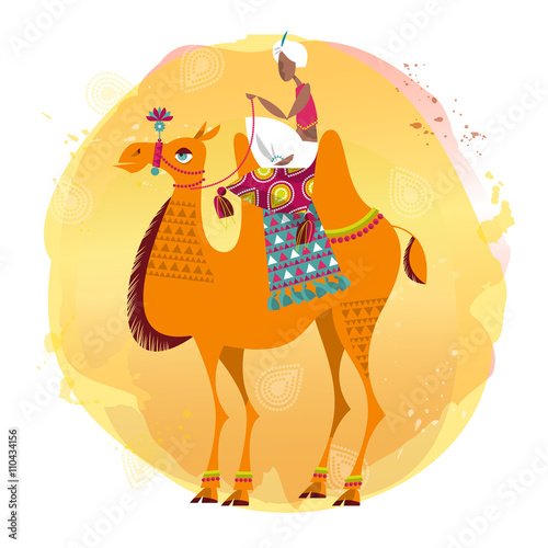 Man sitting on a decorated camel.