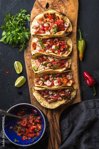 Vászonkép Shrimp tacos with homemade salsa, limes and parsley