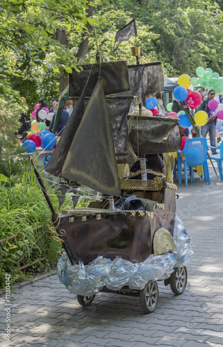 Poster Pram in the form of a sailing boat in the park named after V. C