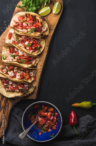 Vászonkép Shrimp tacos with homemade salsa, limes and parsley