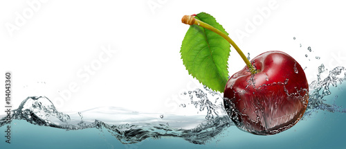 Juicy cherry berry in a spray of cool water.