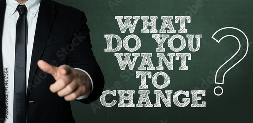 Business man pointing with the text: Do You Want to Change?