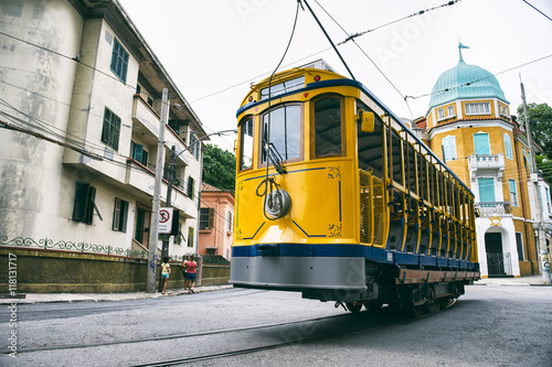 Obraz na płótnie Iconic bonde tram travels along the streets of the tourist nieghborhood of Santa Teresa in Rio de Janeiro, Brazil 