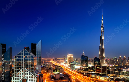 Poster Amazing sunset dubai downtown skyline with tallest skyscrapers and beautiful blu