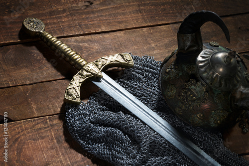 ancient sword, chain armor and the soldier's helmet with horns o