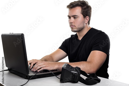 Poster Virtual Reality app developer working with a headset and a computer