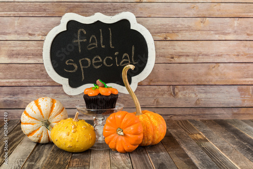 Poster Fall pumpkin muffin with chalkboard sign and decorative gourds