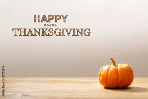 Thanksgiving message with orange pumpkin © Tierney