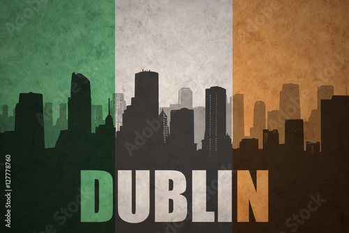 Poster abstract silhouette of the city with text Dublin at the vintage irish flag