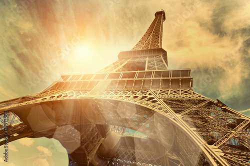 Fototapeta The Eiffel tower is one of the most recognizable landmarks in the world under sun light