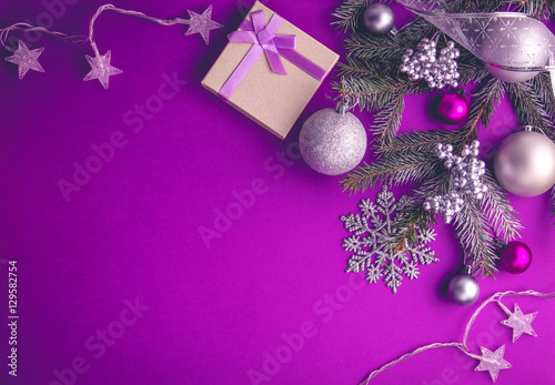 Purple Christmas background with a present © maryviolet