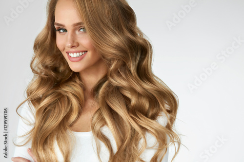 Poster Beautiful Curly Hair. Girl With Wavy Long Hair Portrait. Volume