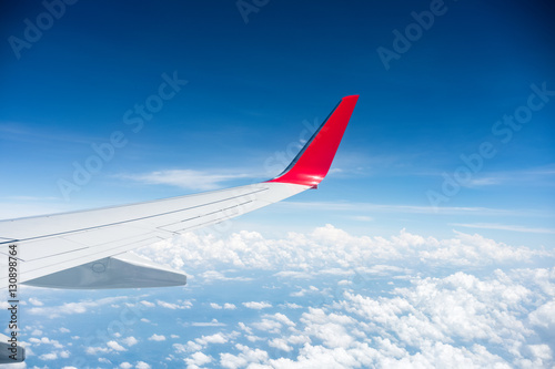airplane wing above the clouds