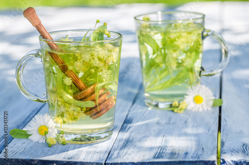 Fresh linden tea with sweet honey in sunny day