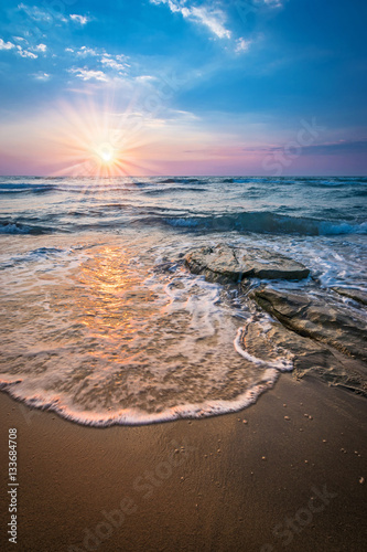 Sunray over sea in Tuscany