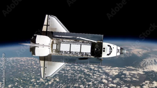Space shuttle floats in space. Perfect of computer graphics videos about: space, earth, orbit, ISS, the International Space Station, astronauts, NASA and discovery