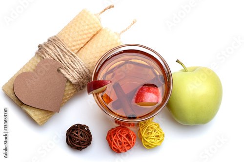 apple tea with cinnamon, candle, valentines heart isolated on white