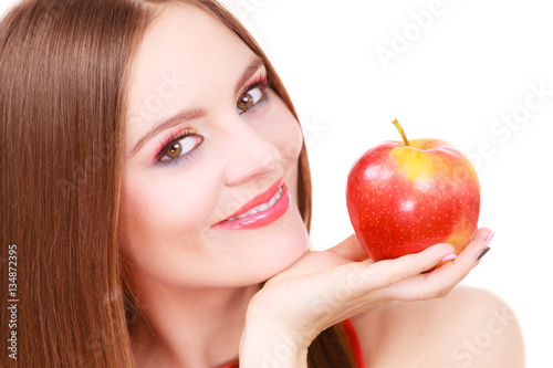 Woman charming girl colorful makeup holds apple fruit