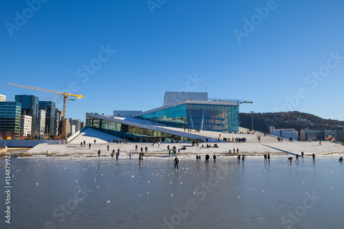 Poster Oslo Opera house with walking and relaxing people at sunny winter day