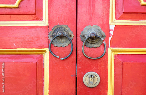 Poster Handle and lock on chinese red wooden decorated door for background