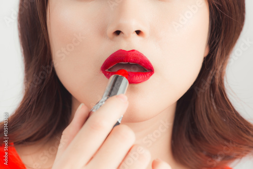Young asian sexy woman with dark hair using red lipstick Poster