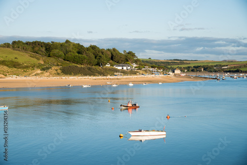 View of the Camel estuary at low tide with the touristic village Rock in Cornwall. View from Padstow on the opposite site of the estuary.