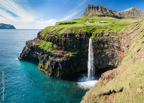 Poster waterfall on faroe islands and the village Gasadalur in background