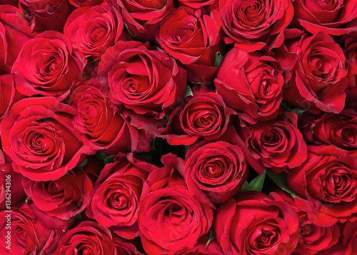 Colorful flower bouquet from red roses for use as background. Closeup.