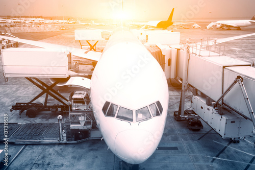 airport with crowded airplanes with sunbeam