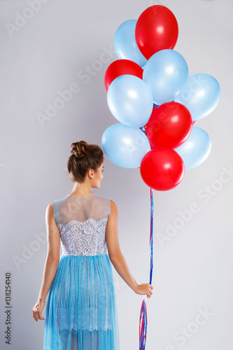 Poster Wwoman wearing beautiful dress with a lot of colorful balloons