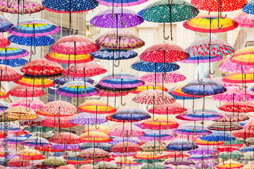 Poster Colorful umbrellas on the ceiling of the largest mall in the world Dubai Mall UAE