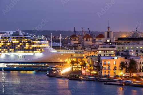 Poster Old Havana at sunset with a view of historic buildings and a modern cruise ship