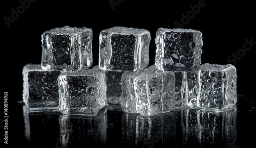 Lacobel ice cubes on reflection table on black background