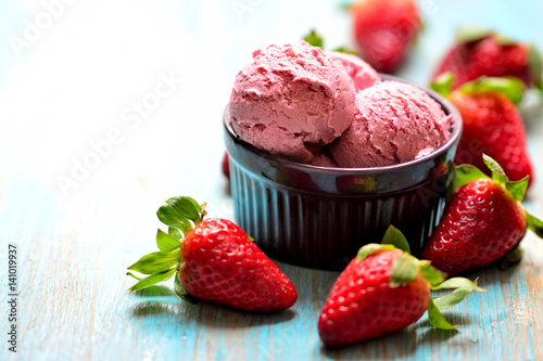 Strawberries and ice cream in a bowl
