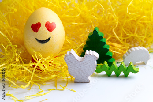 Poster Happy easter: emoji as easter egg in yellow gras - smiling face with heart shape